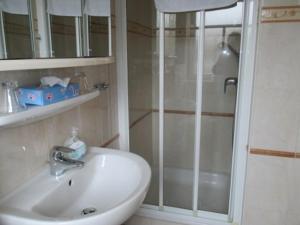 a bathroom with a sink and a shower at Behrs Hof in Scharmbeck +21 photos