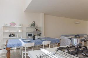 Kuchyň nebo kuchyňský kout v ubytování Villa Unica Terrazzo Sul Mare