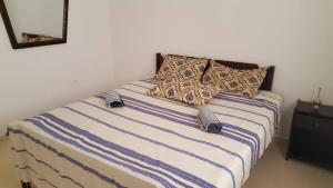 A bed or beds in a room at Appartement à Houmt Souk Jerba
