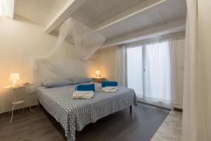 Postel nebo postele na pokoji v ubytování Villa Unica Terrazzo Sul Mare