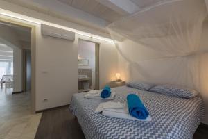 Postel nebo postele na pokoji v ubytování Villa Unica Terrazzo Sul Mare