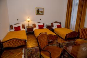 A bed or beds in a room at Hotel Grand
