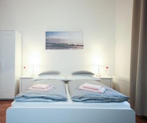 Postel nebo postele na pokoji v ubytování Angel City Aparthotel