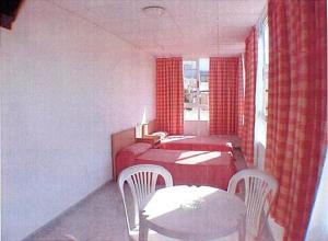 Postel nebo postele na pokoji v ubytování Hotel Iris