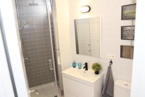 a bathroom with a shower and a sink and a mirror at APARTAMENTO GRANADA CENTRO in Granada +21 photos