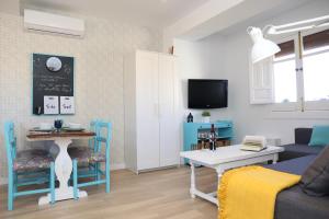 a living room with a couch and a table at APARTAMENTO GRANADA CENTRO in Granada
