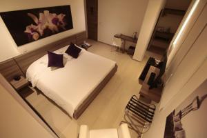 Ένα ή περισσότερα κρεβάτια σε δωμάτιο στο BGA Hotel