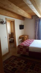 Postel nebo postele na pokoji v ubytování Garnì Astoria Hotel & SPA