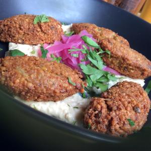 a plate of food with three fried foods and rice at Corella Creek Country Farm Stay in Nelia