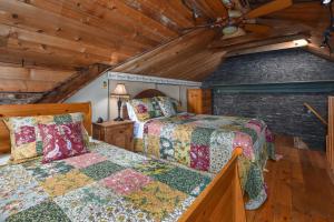 a bedroom with two beds and a ceiling fan at Noble Waterfront Suites in Brockville