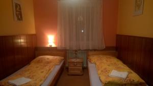 Een bed of bedden in een kamer bij Penzion Lipůvka