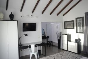 TV tai viihdekeskus majoituspaikassa MAGMA Rooms Playa Honda