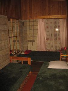 Voodi või voodid majutusasutuse Tammekännu Holiday House toas