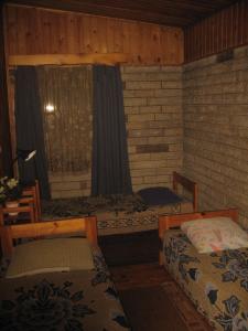 Voodi või voodid majutusasutuse Tammekännu Holiday House toas