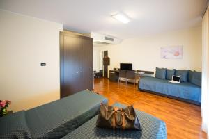 a living room with a couch and a table at Draconerium Hotel in Dronero