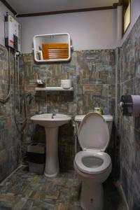 a bathroom with a toilet and a sink at Cocco House in Ao Nang Beach