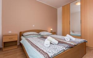 Posteľ alebo postele v izbe v ubytovaní Apartments Kraljić I