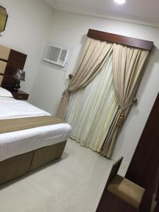 Voodi või voodid majutusasutuse Al Massah Al Khalijiyah Furnished Units toas