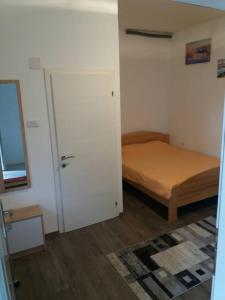 Ένα ή περισσότερα κρεβάτια σε δωμάτιο στο Rooms Adrijana