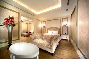 Postel nebo postele na pokoji v ubytování Yen Jim Boutique Motel