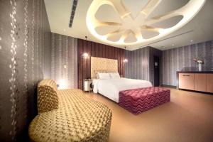 Postel nebo postele na pokoji v ubytování Yen Jim Boutique Motel
