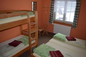 מיטה או מיטות בחדר ב-Pension Čertice