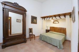 Postel nebo postele na pokoji v ubytování Casa Vacanze Podere Ugolini + 37 fotografií