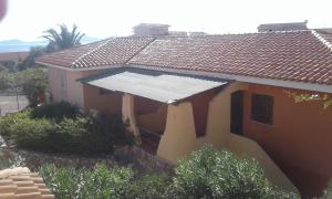a house with a solar panel on the side of it at Residence Spiaggia Bianca in Golfo Aranci