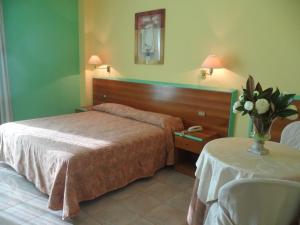 Hotel Parco degli Ulivi客房内的一张或多张床位