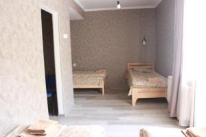 A bed or beds in a room at Hotel Gergeti