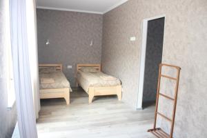 A bed or beds in a room at Hotel Gergeti