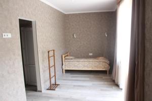 A bed or beds in a room at Hotel Gergeti