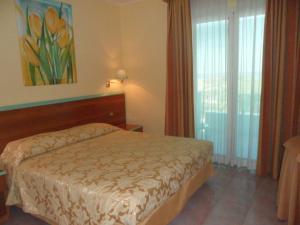 Hotel Parco degli Ulivi客房内的一张或多张床位