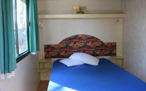 Postel nebo postele na pokoji v ubytování Villaggio Camping Lungomare
