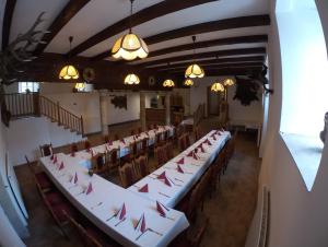 an overhead view of a room with tables and chairs at Šporkův Mlýn in Dvůr Králové nad Labem