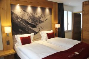 מיטה או מיטות בחדר ב-Hotel Crown