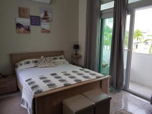 Кровать или кровати в номере Villa Bienvenue Beachfront House