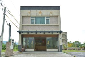 a building with a glass door in front of it at Royal Yado in Zhixue