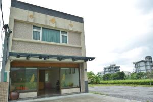 a building with a large glass door in front of it at Royal Yado in Zhixue
