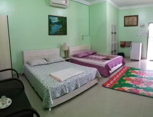 Uma cama ou camas num quarto em Dhia Irdina Homestay