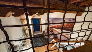 an overhead view of a room with a staircase in a house at Casa Archi - Balcone sul Fiume in Verona