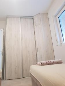 Una cama o camas en una habitación de Apartments Vukovic