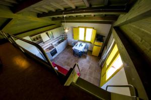 an overhead view of a kitchen with a table in a room at AgriResidence L'Antica Fattoria - sul Lago in Bolsena