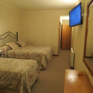 Un ou plusieurs lits dans un hébergement de l'établissement Hotel Patagonia Norte