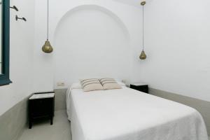 Posteľ alebo postele v izbe v ubytovaní HOSPEDAJE PENSIÓN LA ALMOHADA