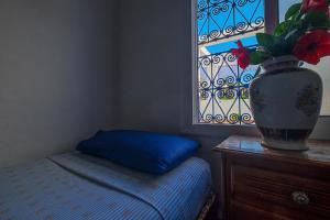 Postel nebo postele na pokoji v ubytování Hostal La Joya
