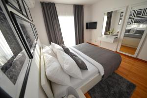 Łóżko lub łóżka w pokoju w obiekcie Sunset Deluxe Villa