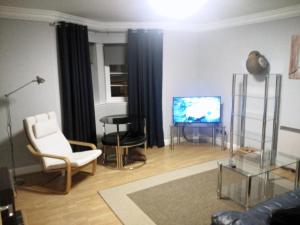 456js Edinburgh Self-Catering Apartmentにあるテレビまたはエンターテインメントセンター