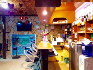 a kitchen with chairs and a counter in a store at Hope Homes in Panglao