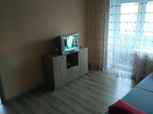 a small television sitting on a cabinet in a room at Apartment on the World in Cherkasy